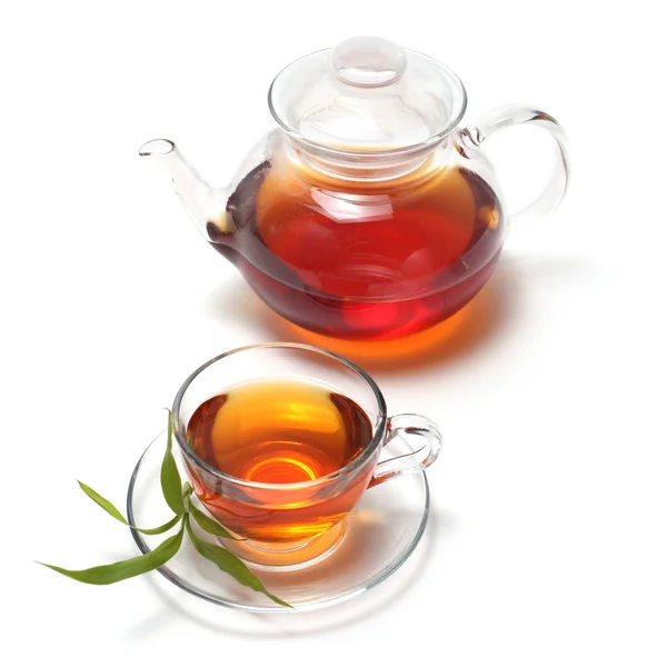 Tasse mit Tee und Teekanne — Stockfoto