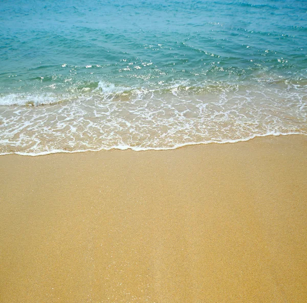Vlna vody a písku pozadí — Stock fotografie