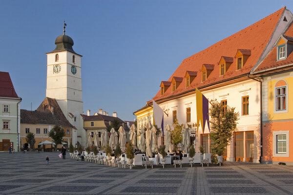 Main square historical architecture in Sibiu Transylvania Romania medieval houses and old tower in background