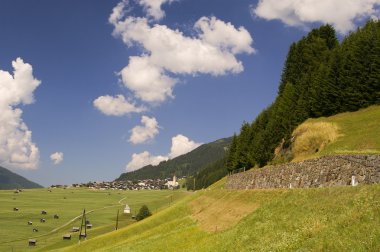 Mountaiin valley village in Austrian Alps clipart