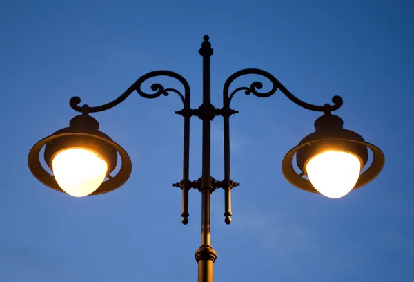 stock image public lantern lights on old style with two bulbs on street in Sibiu