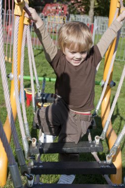 Child in adventure playground clipart