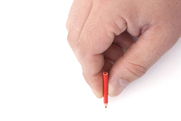Маленький олівець у великій руці — стокове фото