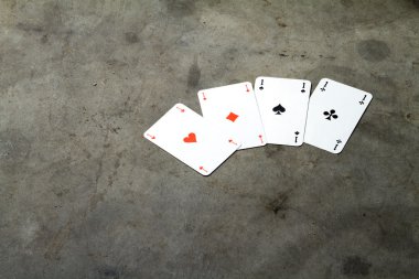 Four aces on a cement floor clipart