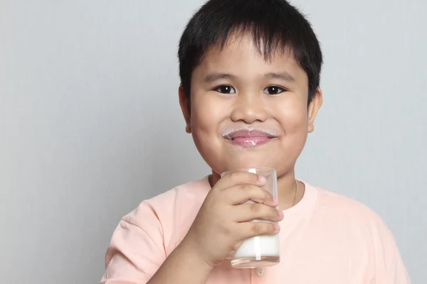 Boy with milk mustache — Stock Photo, Image
