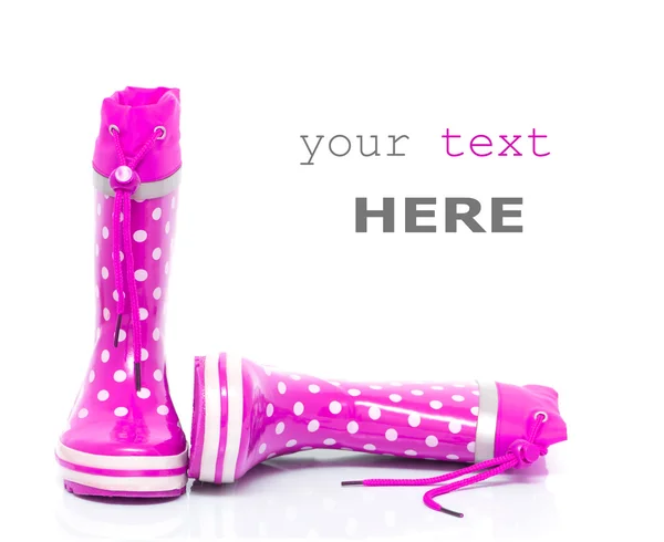 Roze rubberen laarzen — Stockfoto