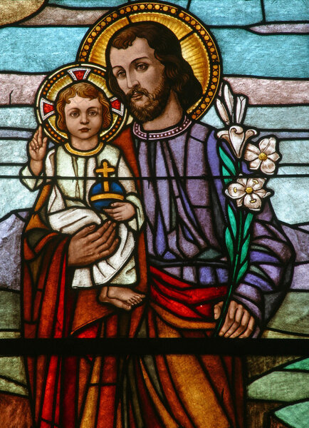 Saint Joseph holding baby Jesus, stained glass