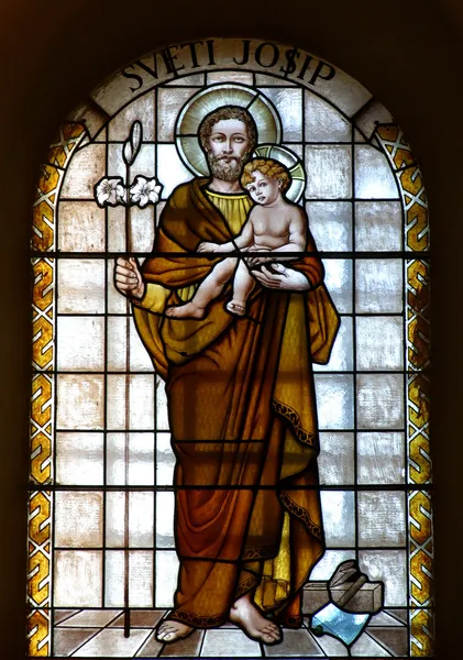 Saint joseph gospodarstwa Jezusa dziecka — Zdjęcie stockowe
