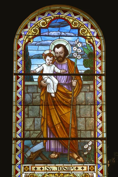 Saint Joseph holding baby Jesus — Stock Photo, Image