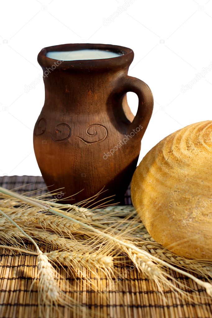 Bread and jug with milk