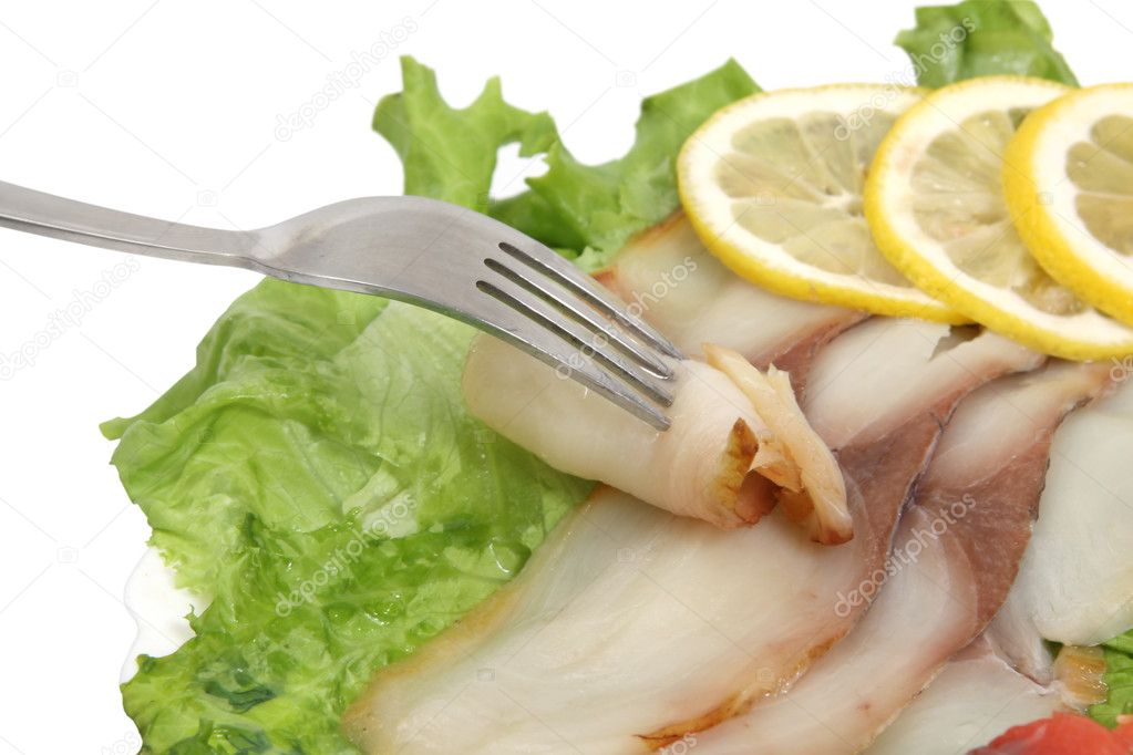 Fork , fish slices and lemon