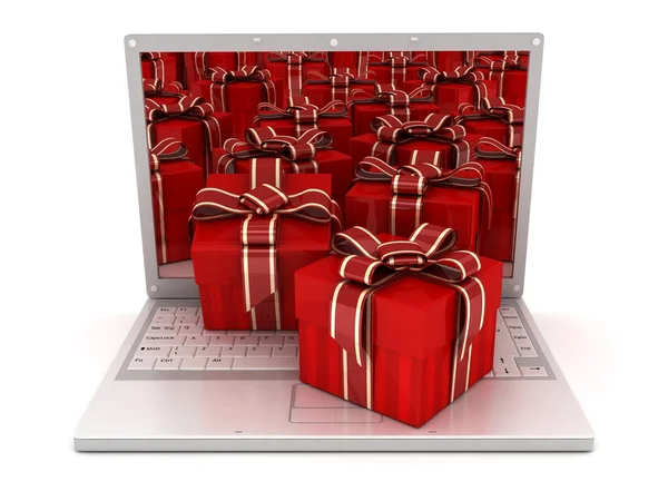 Laptop y muchos regalos —  Fotos de Stock