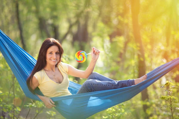 Young beautiful woman in a hammock — Stock Photo, Image