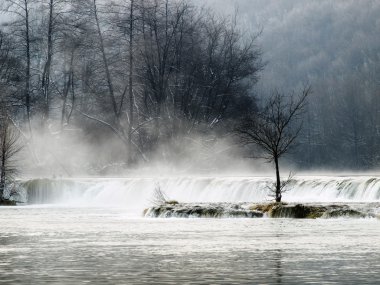 Waterfall in the winter morning on the mountain river called Mreznica in continental part of Croatia. clipart