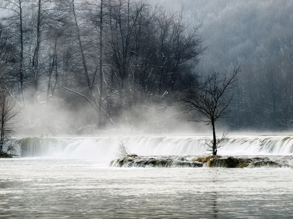 stock image Waterfall in the winter morning on the mountain river called Mreznica in continental part of Croatia.