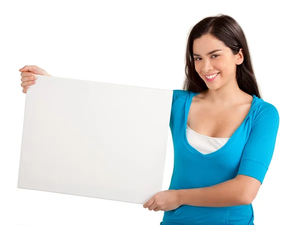 Stock image A beautiful young woman is holding a blank white sign.