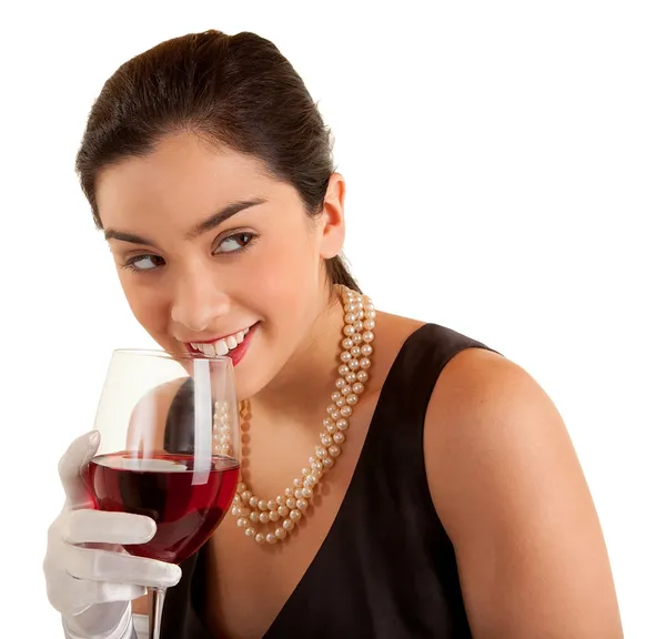 Kobieta trzyma kieliszek wina, patrzył w bok — Zdjęcie stockowe