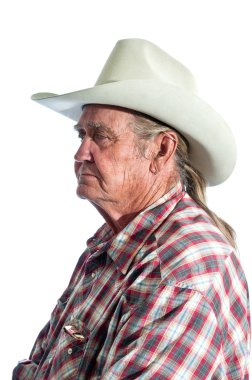 Retired cowboy reflecting on past events clipart