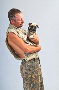 Young man and his pedigreed Pug clipart