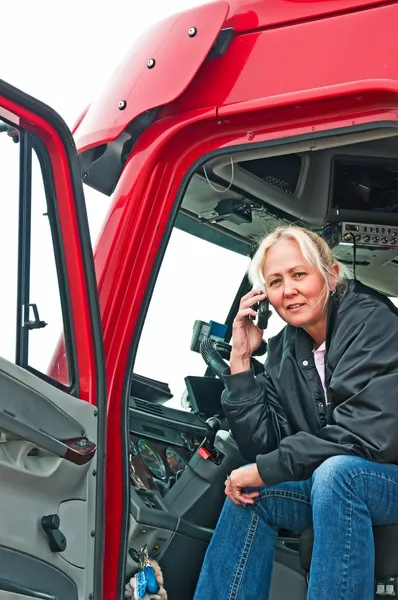 Pretty woman truck driver on phone — Stock Photo, Image