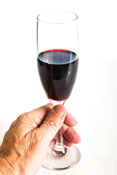 Рука тримає келих червоного вина — стокове фото
