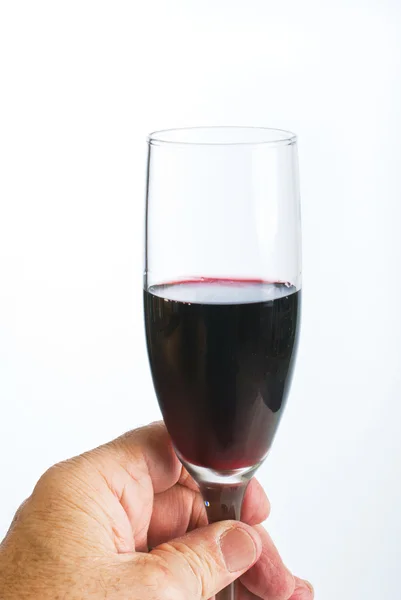 Mão com copo de vinho tinto — Fotografia de Stock