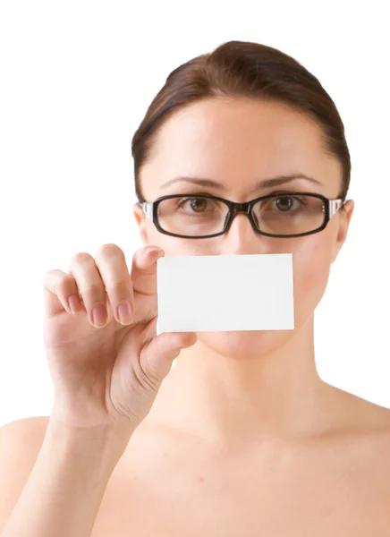 Young woman holding business card. Focus on hand with card — Stock Photo, Image