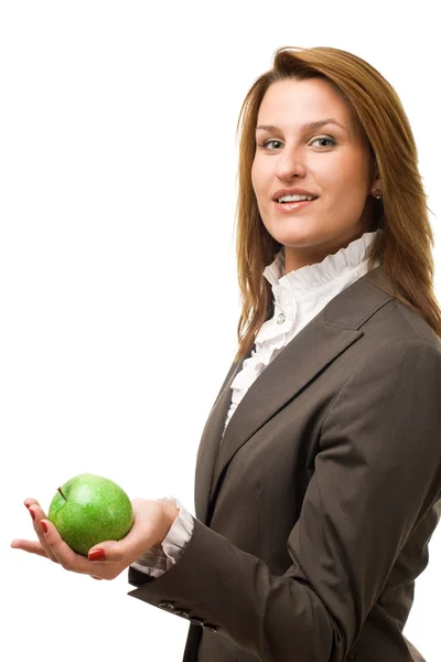 Business woman holding grön apple. — Stockfoto