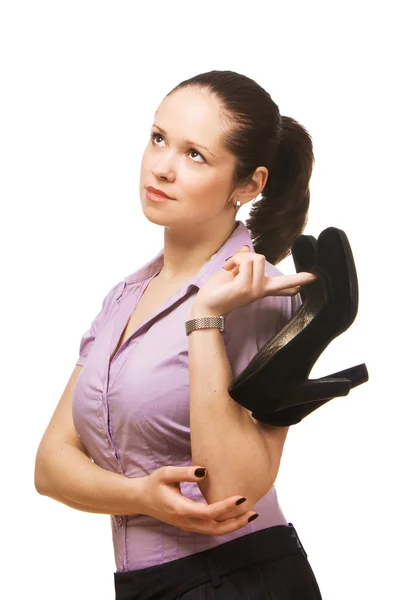 Young beautiful business woman holding shoes — Stock Photo, Image