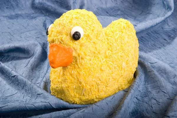 Yellow Coconut Covered Rubber Duck Cake Sits Pond Blue Fabric — Stock Photo, Image