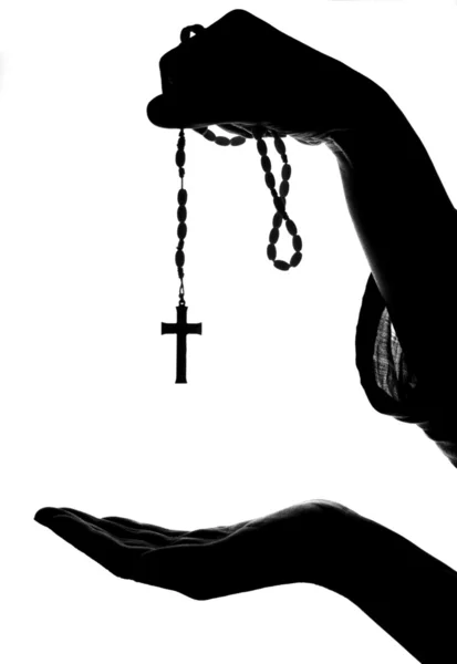 stock image Hand gives rosary