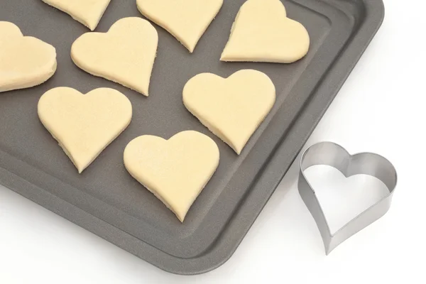 Biscuits et cutter coeur pâtisserie — Photo
