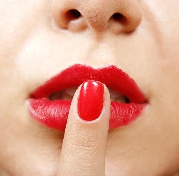Палец на губы — стоковое фото