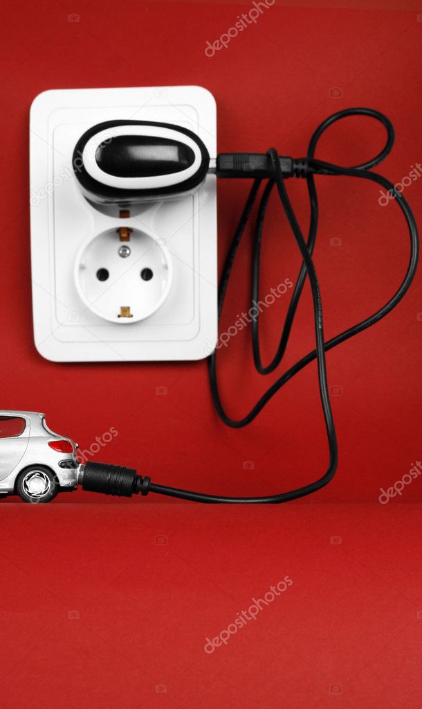 Eco-friendly car isolated on red background