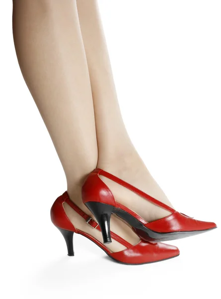 Patas delgadas y zapatos rojos —  Fotos de Stock
