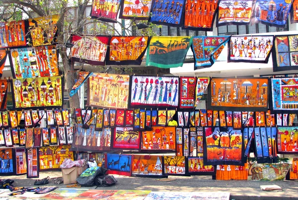 stock image Colorful paintings sold at the street market in Maputo, Mozambique