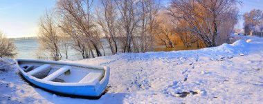 Blue boat near danube river clipart