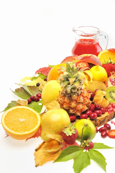 Fresh fruits and red juice — Stock Photo, Image