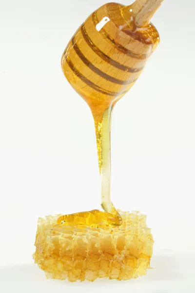 Miel con palo de madera —  Fotos de Stock