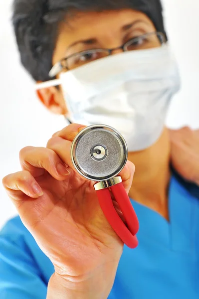 Doctor with stethoscope on a white — Stock Photo, Image