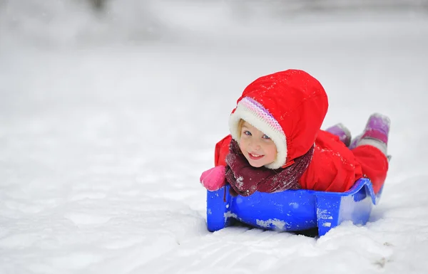 Girl on sleigh — Stock Photo, Image