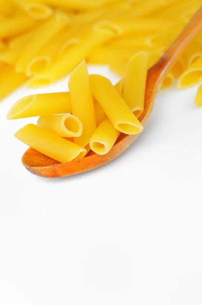 Penne and spoon — Stock Photo, Image