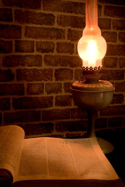 stock image Opened book with candle lamp