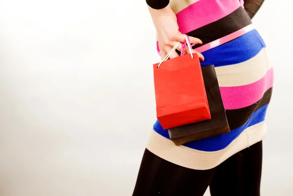 Parte mujer cuerpo mano y dos bolsas de compras —  Fotos de Stock