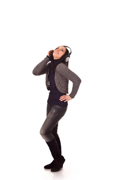 Cute woman listens to music with headphones — Φωτογραφία Αρχείου