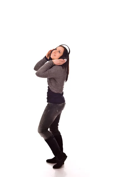 ヘッドフォンを通して音楽を聞くことによって揺れの女性の写真 — ストック写真