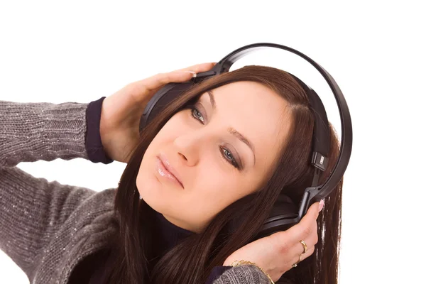 Cute woman listens to music with headphones — Stock Photo, Image