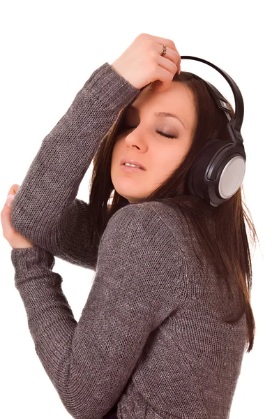 Cute woman listens to music with headphones — Stock Photo, Image