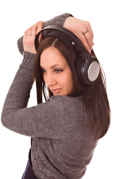 Mujer linda escucha música con auriculares — Foto de Stock