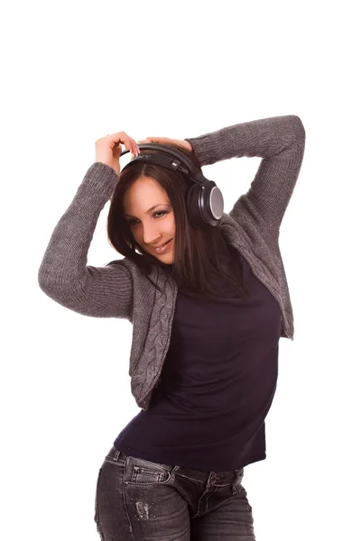 ヘッドフォンを通して音楽を聞くことによって揺れの女性の写真 — ストック写真